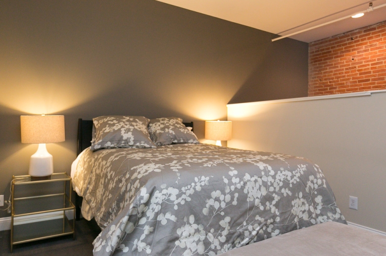 Greenehouse bedroom with exposed brick detailing