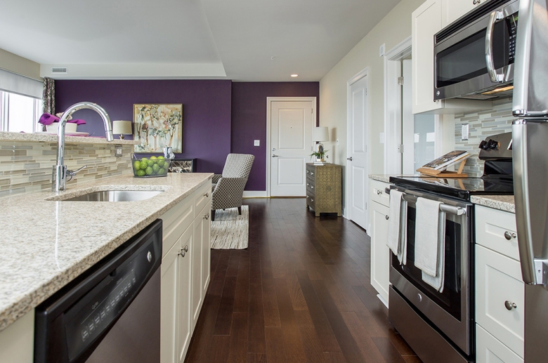 Open concept kitchen and living area at One Water Street