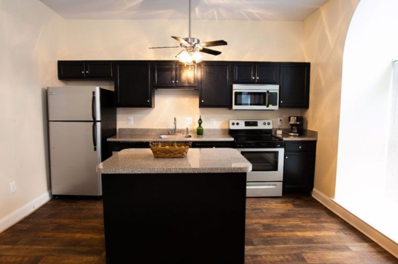 Renovated kitchen with ceiling fan