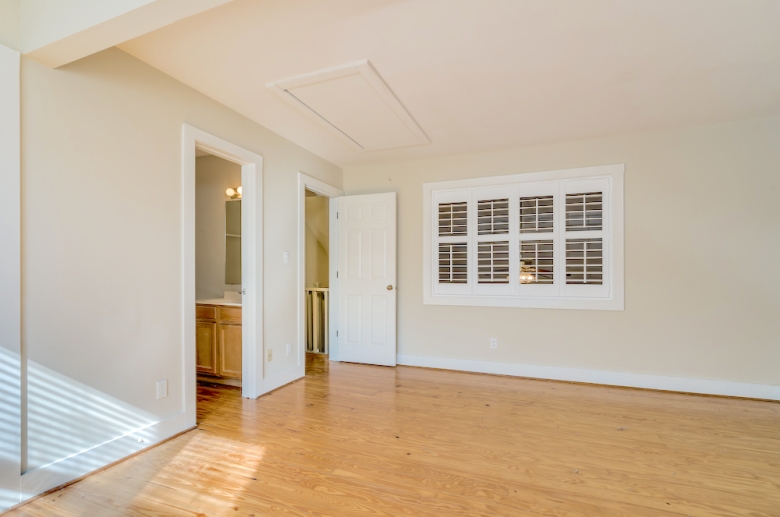 Bedroom featuring private bathroom