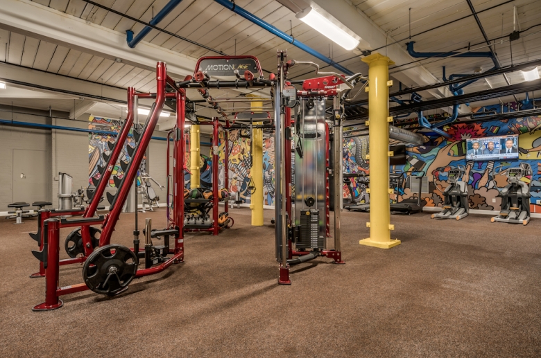 Strength training equipment at The Cottages inside the fitness center