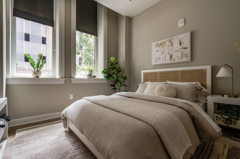 Furnished bedroom with oversized windows