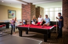 Lounge with pool table at 612 Whaley 