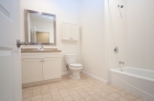 Bathrooms featuring new ceramic tile and granite countertops 
