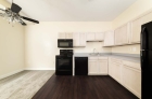 Kitchen with hardwood flooring