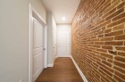 Historic touches include exposed brick walls 