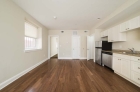 galley kitchen and open concept living space