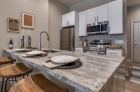 Modern kitchen space with waterfall granite countertops at 1420 Chestnut Street