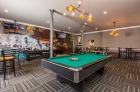 Strouse Adler billiard and shuffleboard space at social lounge