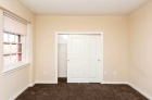 Bedroom with fresh wall-to-wall carpeting