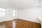 Dining space with gleaming hardwood floors