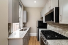 Galley kitchen with granite countertops