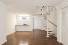 Bi-level unit with spiral staircase