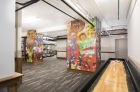 Shuffleboard deck next to the gym and lounge