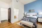 Bedroom with hardwood flooring