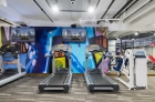 Flatscreen TV and radio at 915 Main Street fitness center