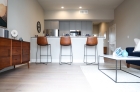 Living and barstool kitchen island seating 
