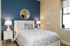 Bedroom with hardwood flooring