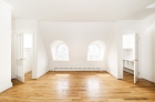 Bedrooms with hardwood flooring and curved dormer windows