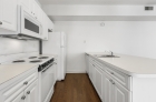 Kitchen featuring white appliances 