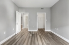 Bedroom with hardwood flooring