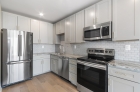 Stainless steel appliances and tile backsplash