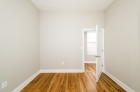 bedroom with hardwood flooring