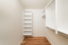 Walk-in closet with built-in shelving at 2121 Market