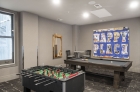 Resident lounge with pool table and foosball 