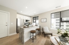 Kitchen and dining area with city views