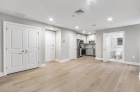 Hardwood flooring and recessed lighting in common spaces