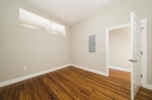 Bedroom with hardwood flooring