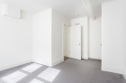 Bedroom with wall to wall carpeting