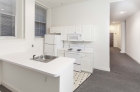 Kitchen at 1222 Arch Street featuring white appliances and cabinets