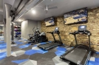 Modern cardio machines and televisions on the fitness center