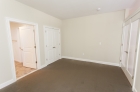 Bedroom with wall to wall carpeting