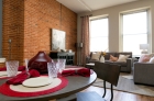 Dining space with exposed brick wall