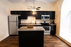 Renovated kitchen with ceiling fan