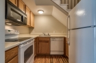 Kitchen featuring wooden cabinets