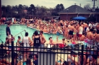 Residents gather around the pool