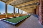 An exterior bocce court at The Mills