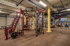 Strength training equipment at The Cottages inside the fitness center