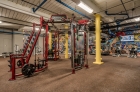 An array of strength training equipment in The Mills gym
