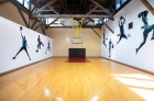 interior of gym with decorations of basketball players