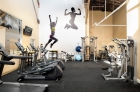 gym interior with machines and decorations of people working out